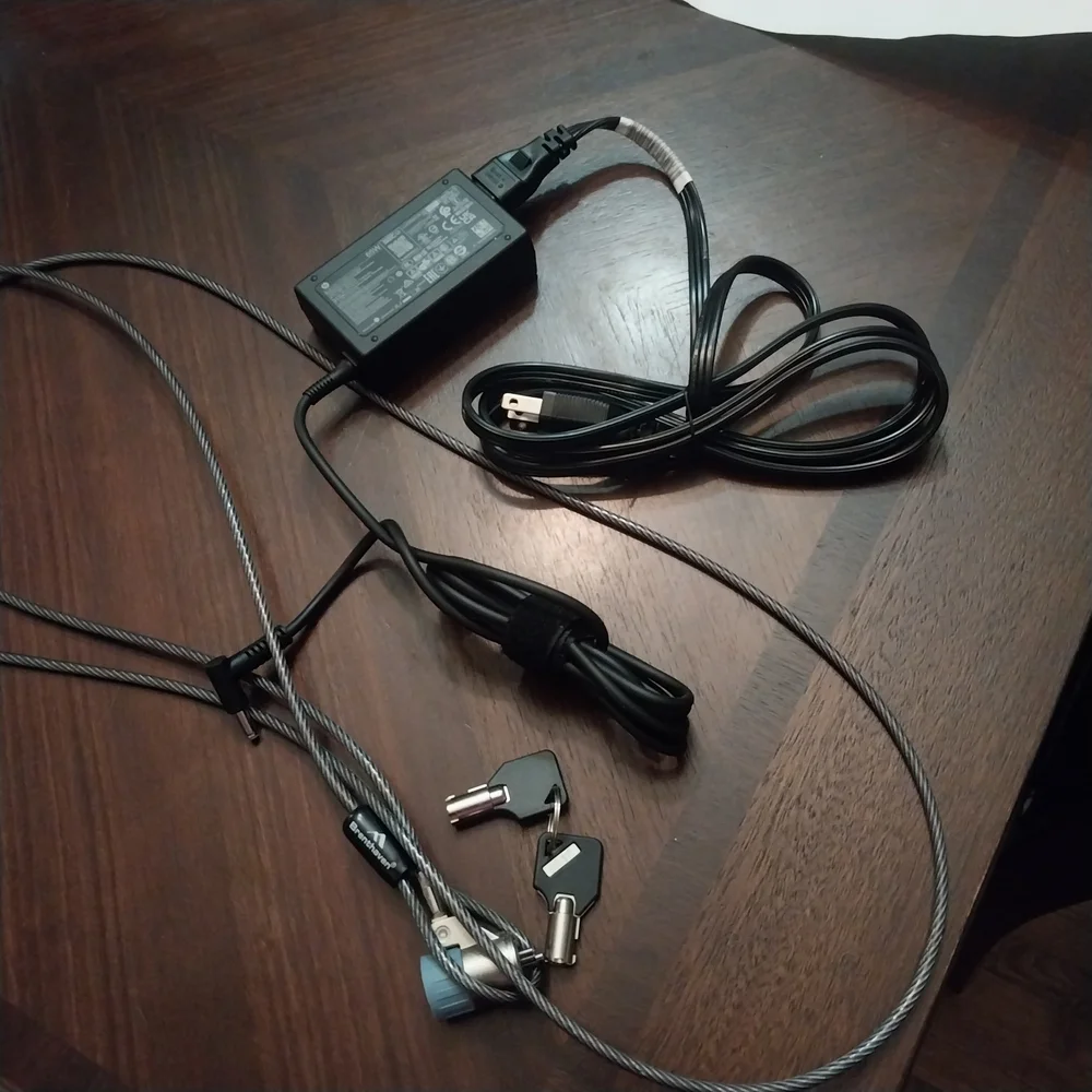 Brand New HP Laptop Charger With Targus Black Laptop Bag And Desk Lock.